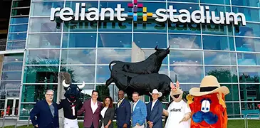 Reliant Stadium sign with mascots and leaders