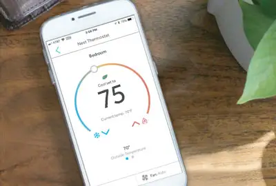 Reliant app on a smartphone thermostat set to 75