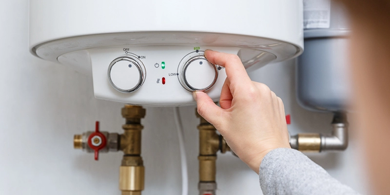 Homeowner adjusting water heater