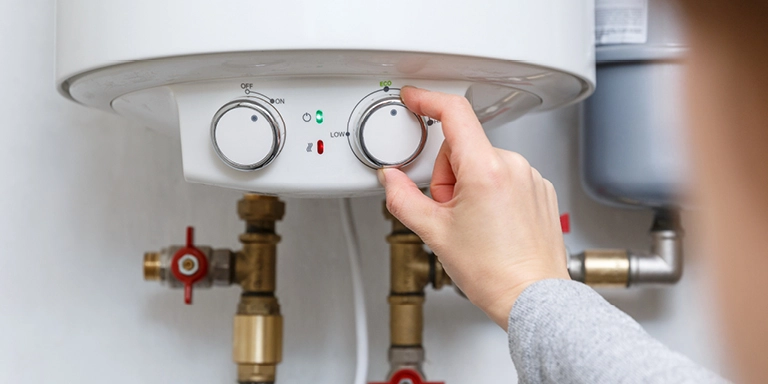 Homeowner adjusting water heater