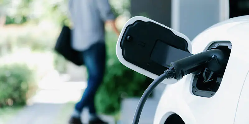 Homeowner leaving his EV to charge at home