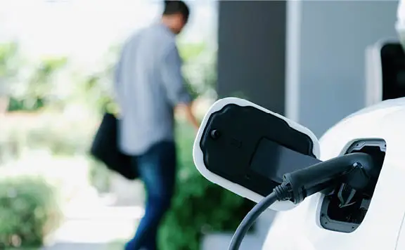 Homeowner leaving his EV to charge at home
