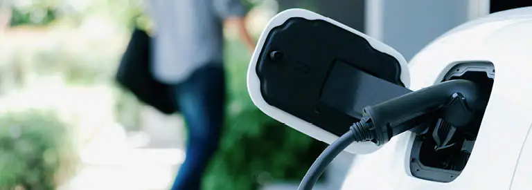 Homeowner leaving his EV to charge at home