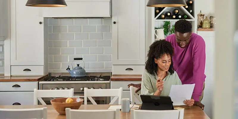 Husband and wife reviewing electricity bill