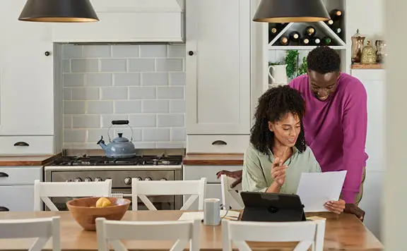 Husband and wife reviewing electricity bill
