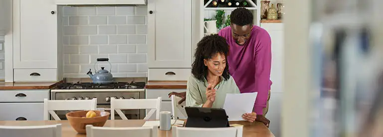 Husband and wife reviewing electricity bill