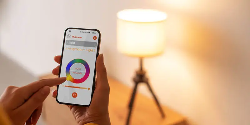 Lady adjusting light color from smart home app on phone