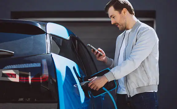 Man charging his EV at home