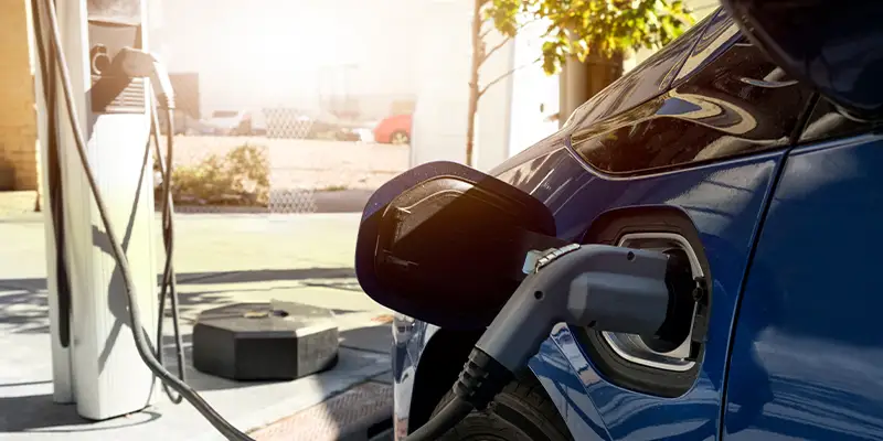 Electric vehicle charging at EV charging station