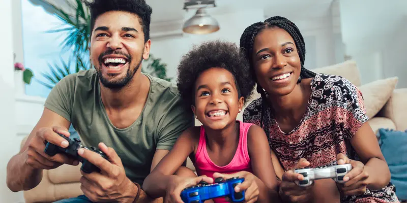 family having weekend fun video gaming
