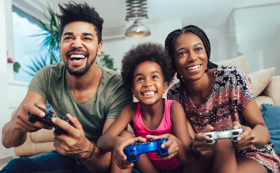 family having weekend fun video gaming