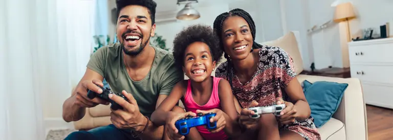 family having weekend fun video gaming