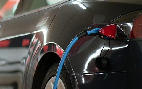 EV car plugged in charging