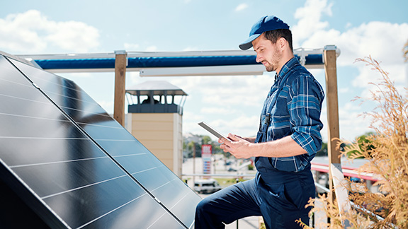 Man installing home solar panels