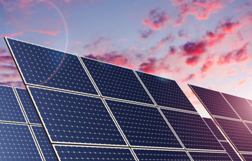 Solar panel farm at sunset